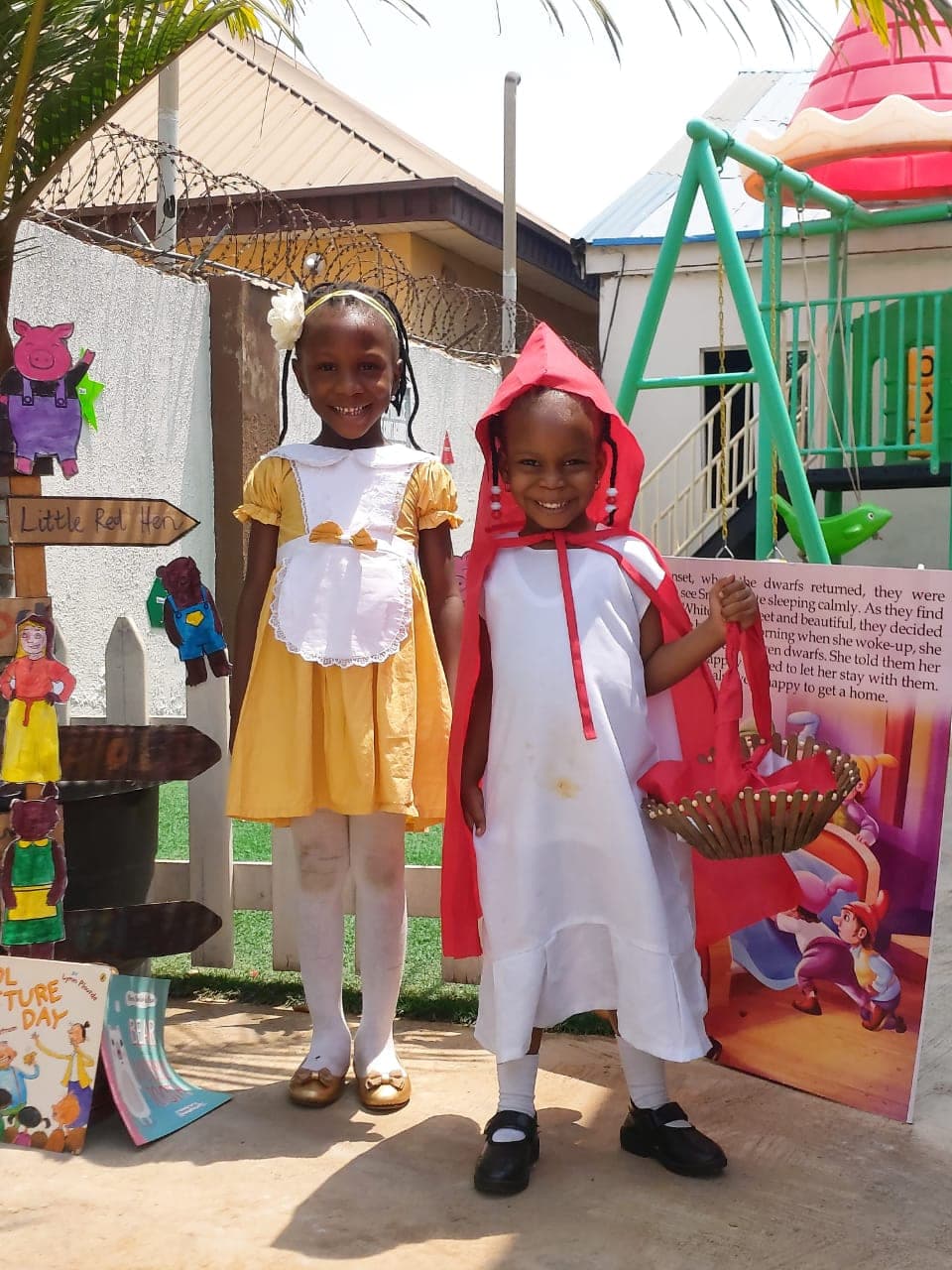 Two pupils dressed as Little Red Riding Hood and Goldilocks for World Book Day
