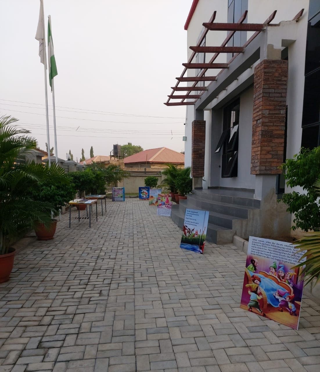 The paved walkway leading between the school buildings