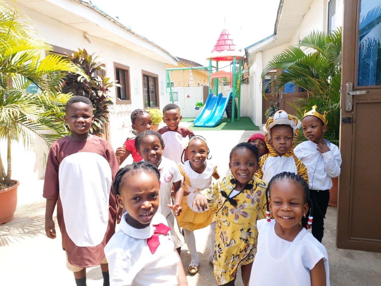 Pupils in matching ankara print gathered in the courtyard for Cultural Day