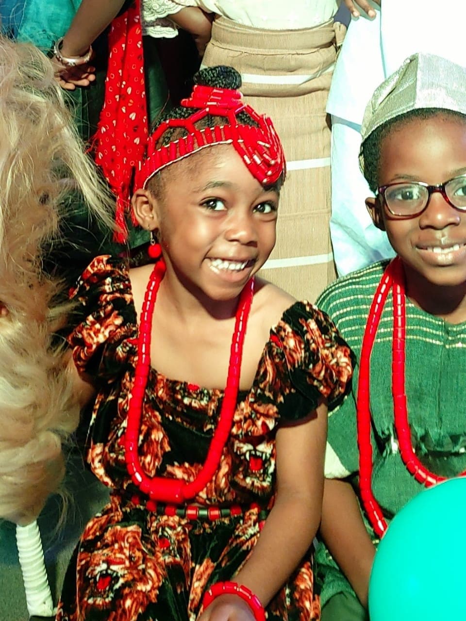 Two pupils in traditional Nigerian dress and coral beads on Cultural Day
