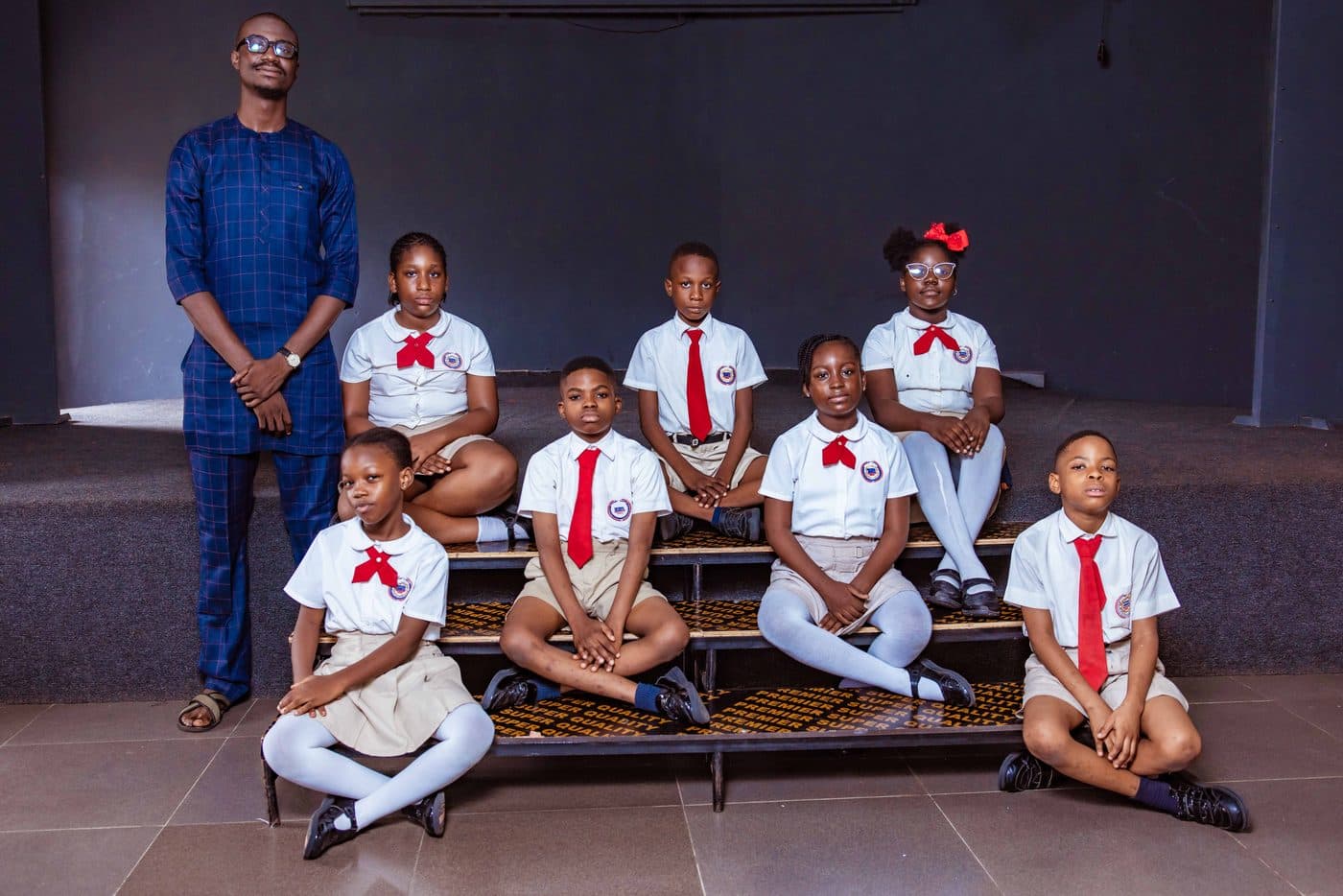 A class photographed with their teacher
