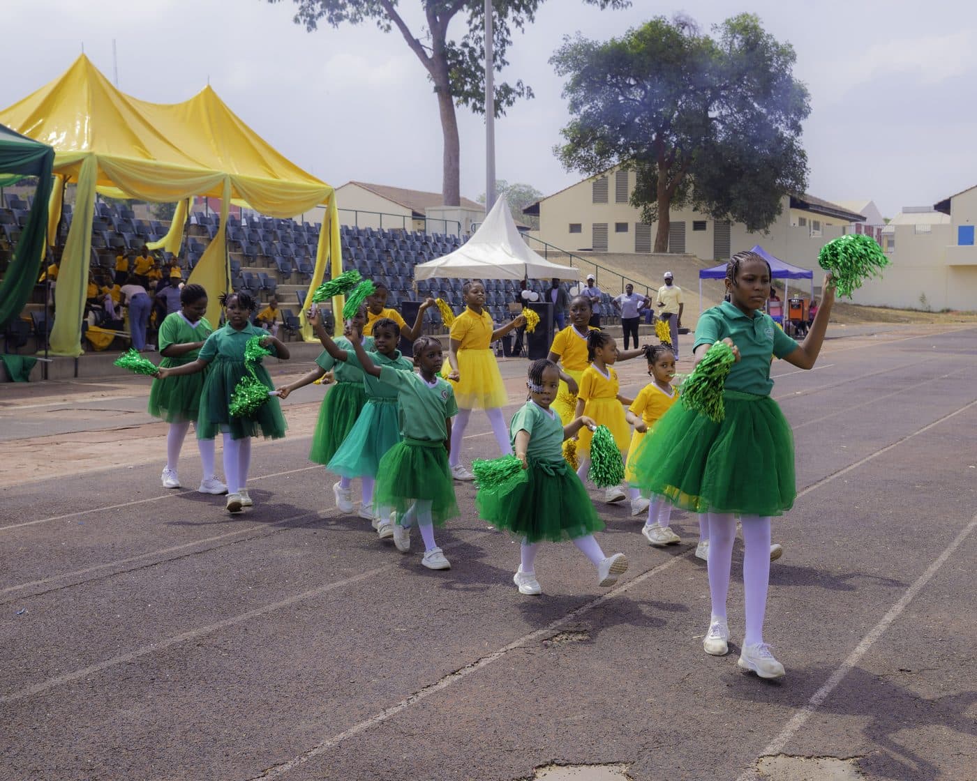 Pupils marching past in house colours at inter-house sports