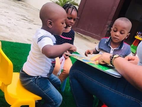 Sharing a picture book on the playground