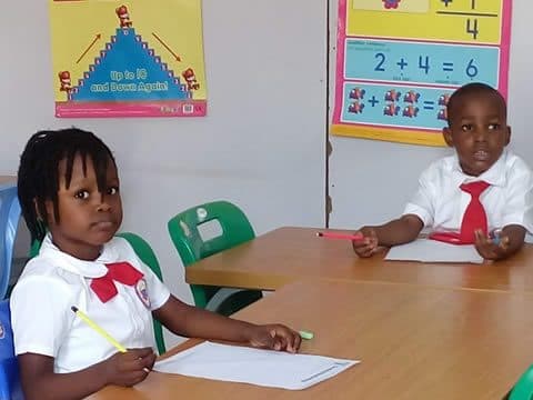Working through a maths exercise at the desk