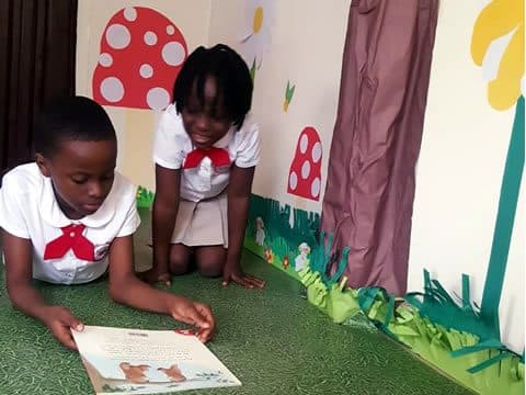 Two pupils reading side by side
