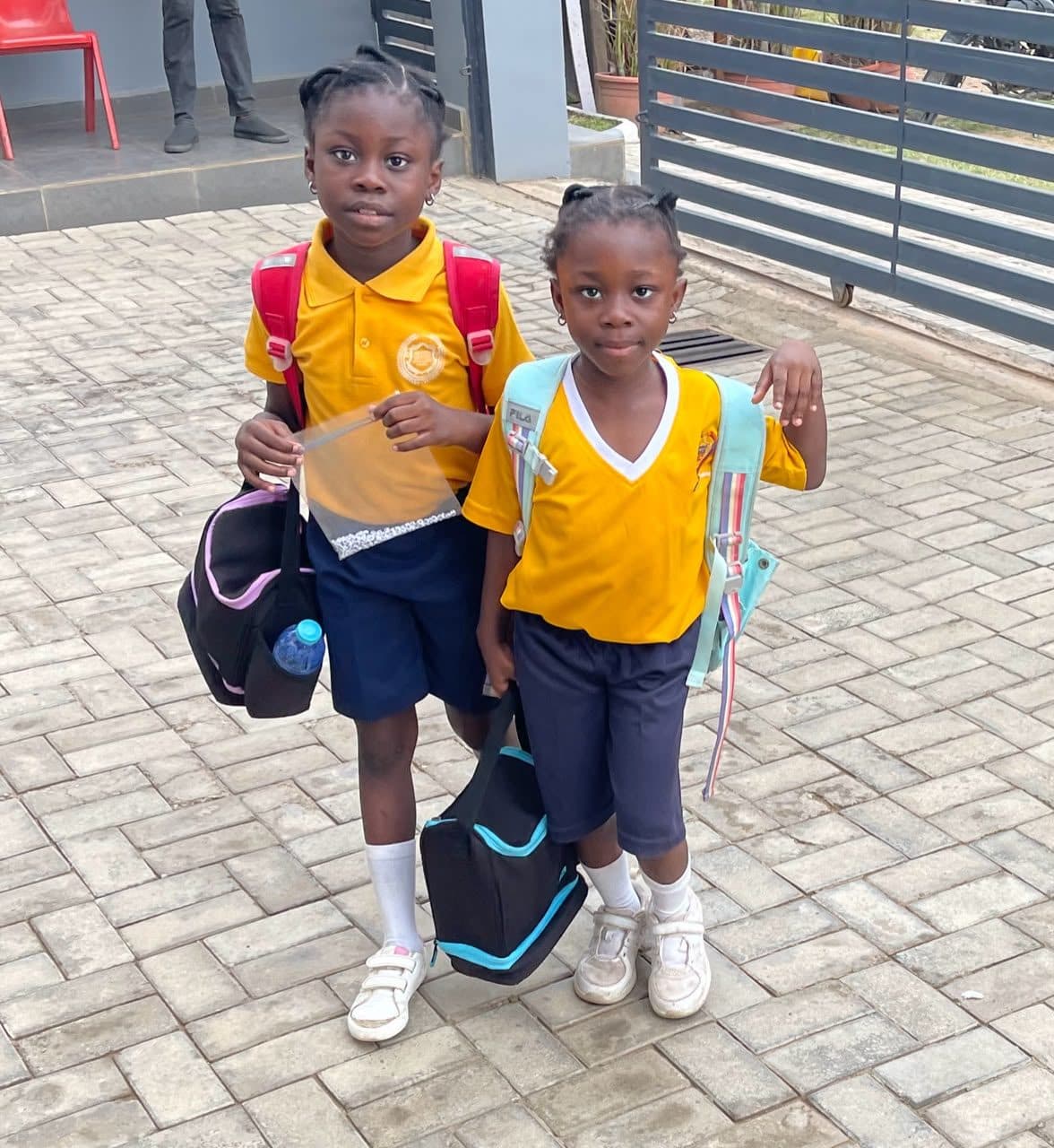 Two pupils arriving with their backpacks on the first day
