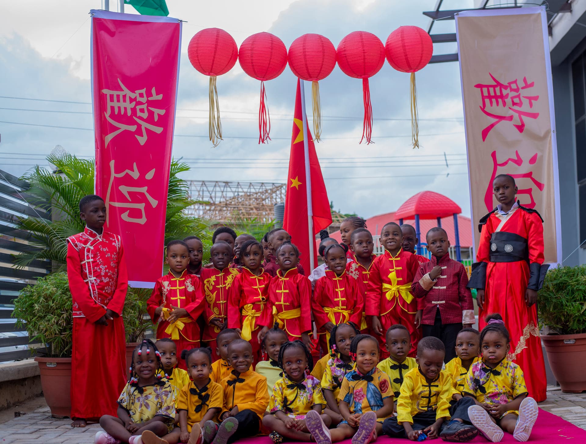 The whole school in costume for Cultural Day, photographed on the red carpet