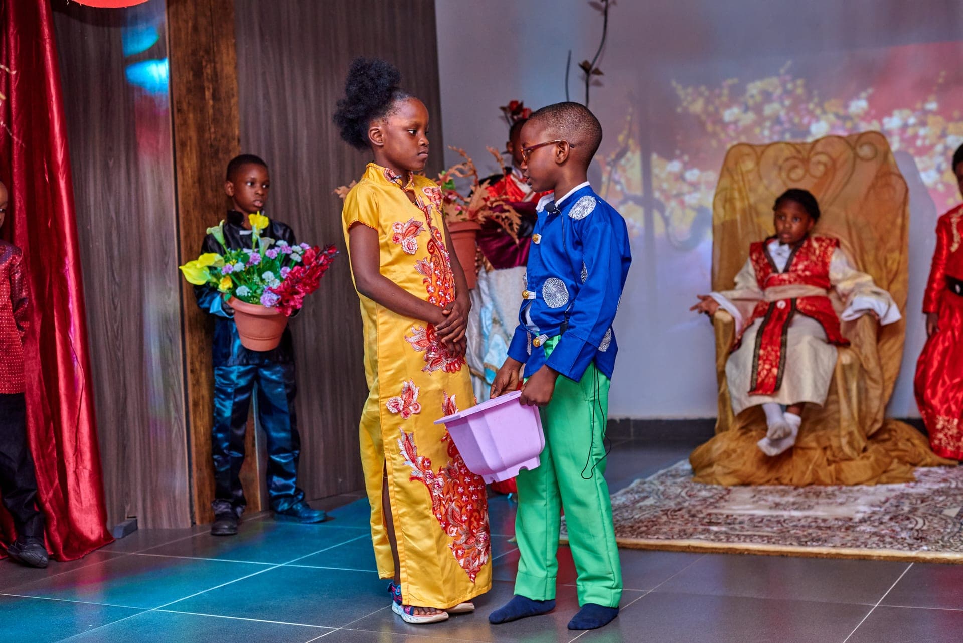 Pupils in costume acting out a scene from our cultural production