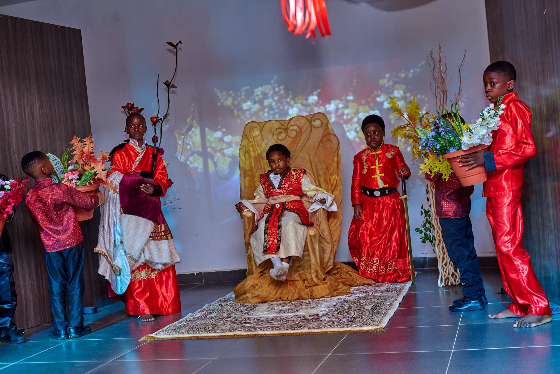 Courtiers presenting gifts to the throne in the Cultural Day play
