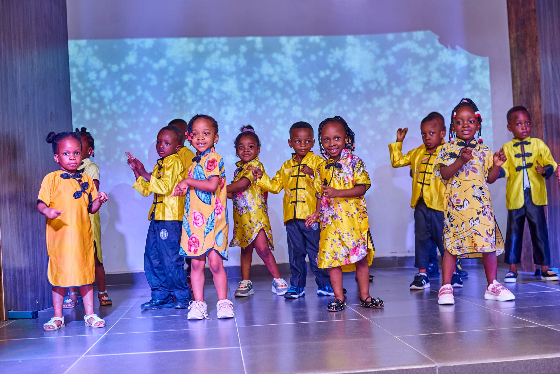 The Cultural Day ensemble mid-song under the stage lights