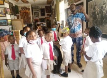 A guide showing our pupils around a gallery of Nigerian art