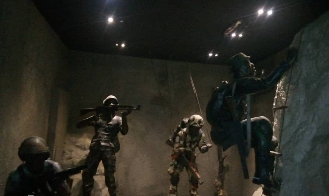 Pupils studying a historical diorama in one of the museum galleries